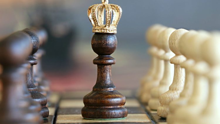 Chess piece wearing a crown