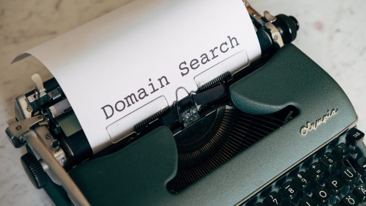 Typewriter spelling out "Domain Search"