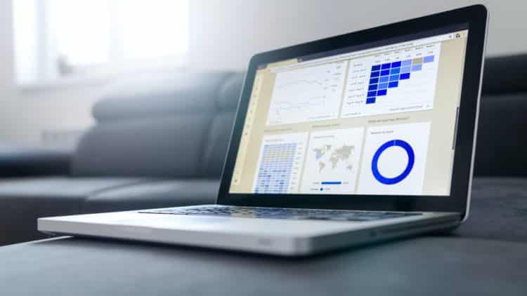 laptop with charts on it